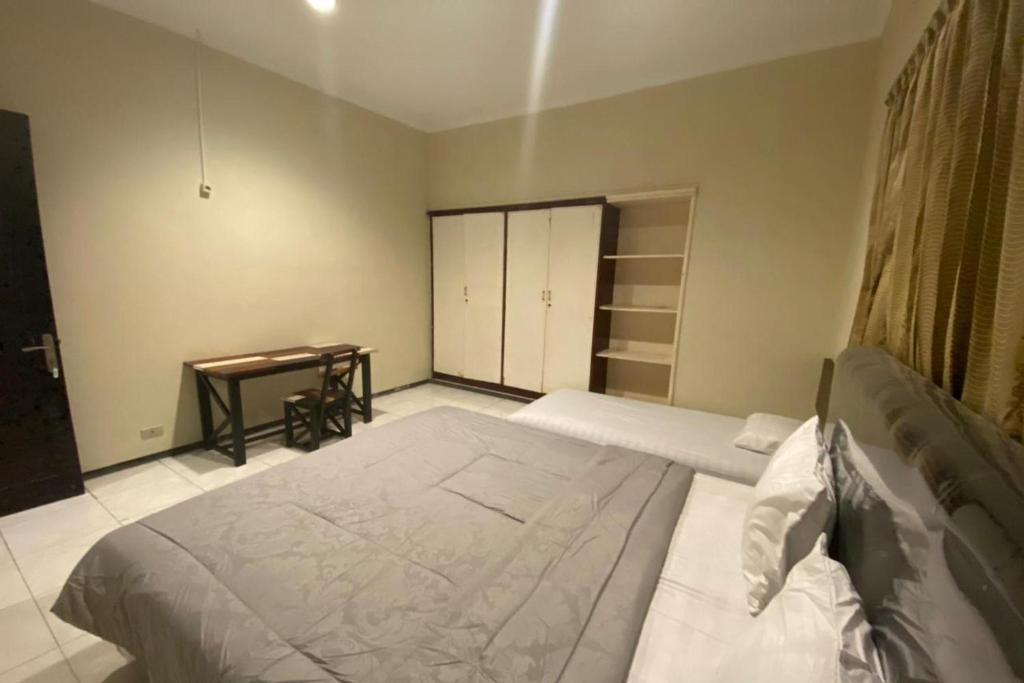 Postel nebo postele na pokoji v ubytování Sweet Home Residence Simpang Lima