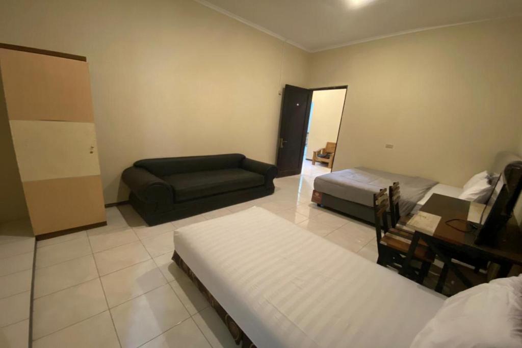 Postel nebo postele na pokoji v ubytování Sweet Home Residence Simpang Lima