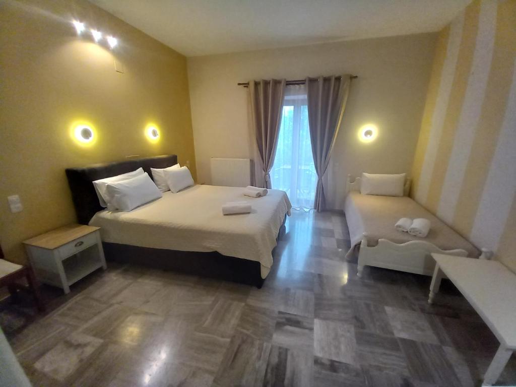 Postel nebo postele na pokoji v ubytování Hermes Hotel