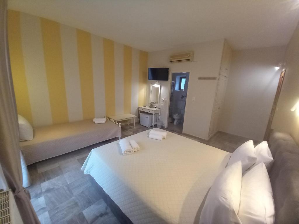 Postel nebo postele na pokoji v ubytování Hermes Hotel