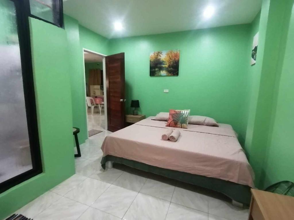 Postel nebo postele na pokoji v ubytování Andresas Homestay