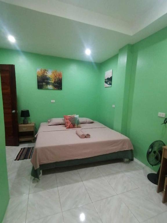 Postel nebo postele na pokoji v ubytování Andresas Homestay