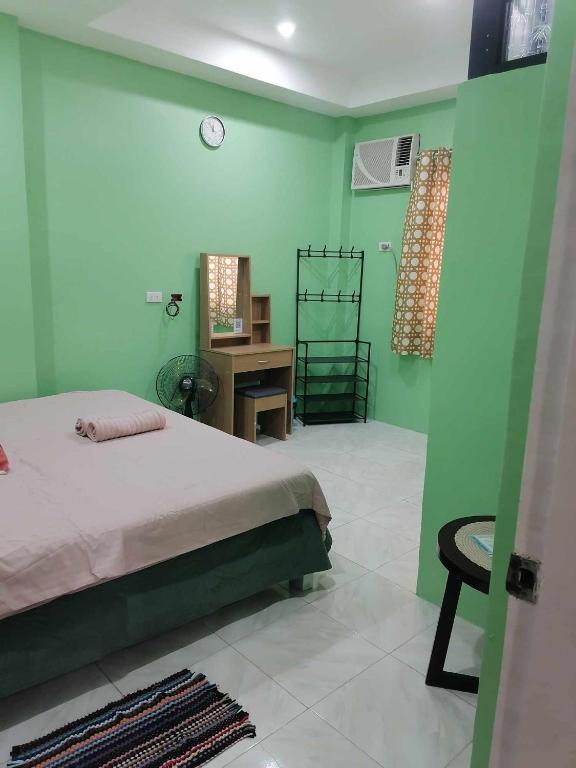 Postel nebo postele na pokoji v ubytování Andresas Homestay