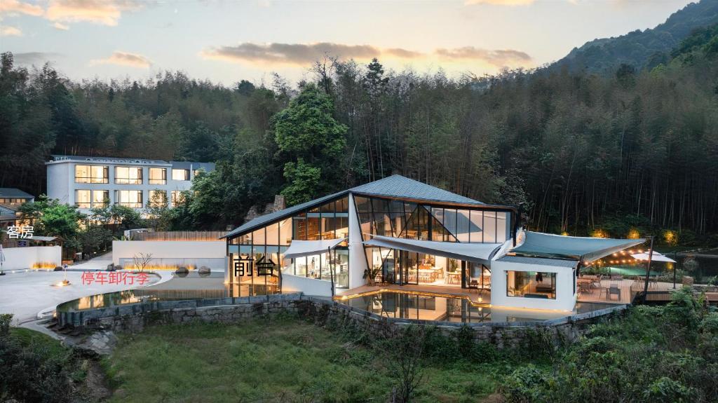an aerial view of a large building with glass at Congxi Creek Resort in Conghua