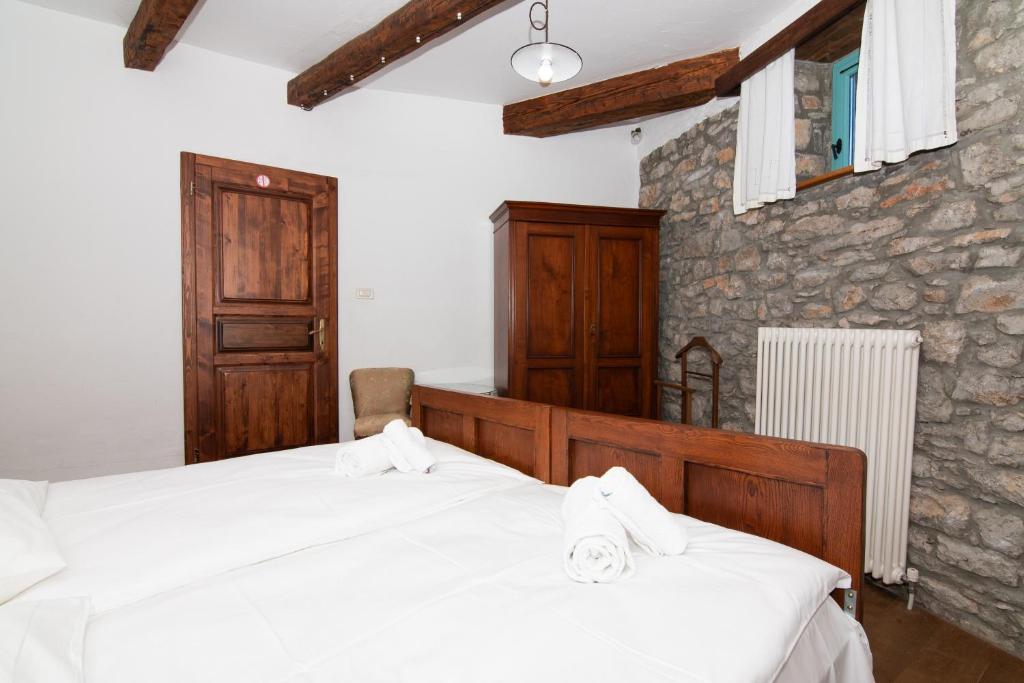Postel nebo postele na pokoji v ubytování Apartments Valentinus 1800
