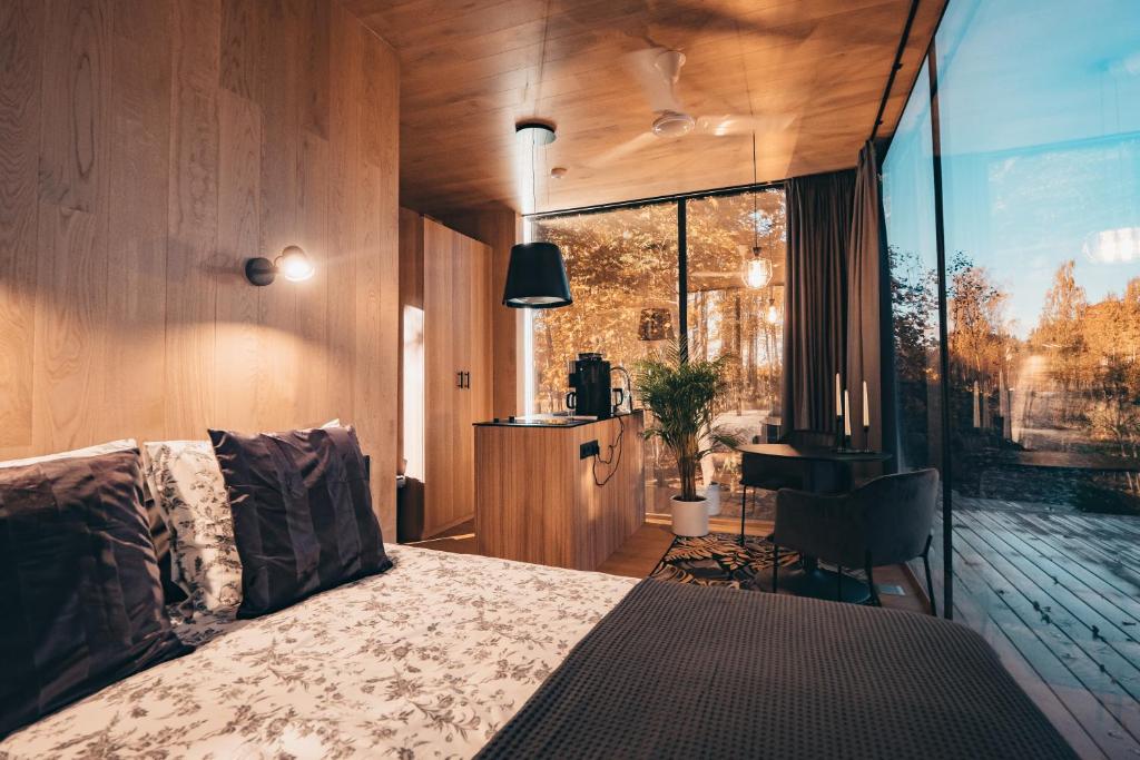 Postel nebo postele na pokoji v ubytování Mimpi Experience Peegelmajad