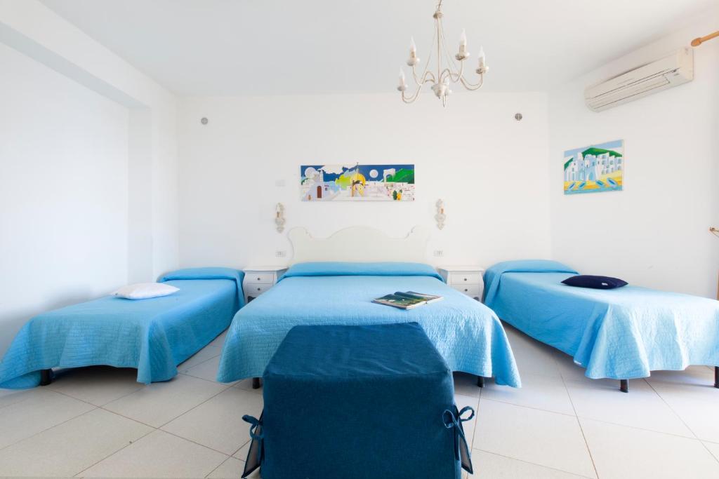 Postel nebo postele na pokoji v ubytování La Maliosa Positano