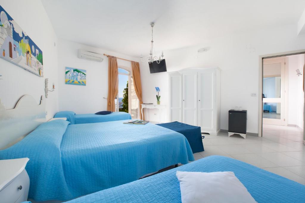 Postel nebo postele na pokoji v ubytování La Maliosa Positano