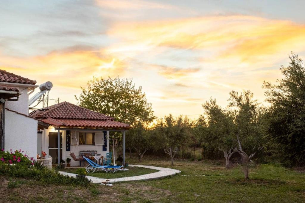 a house with a path leading into a yard at Petalidi Sunny Home One - Charming Garden Nest in Petalidi