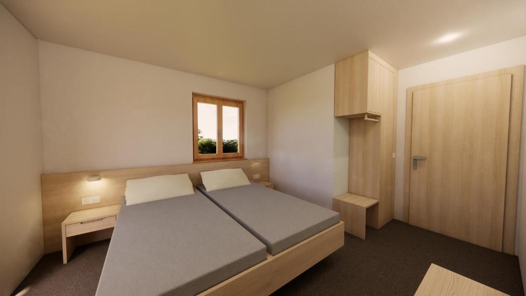 Postel nebo postele na pokoji v ubytování Hotel Stülzis