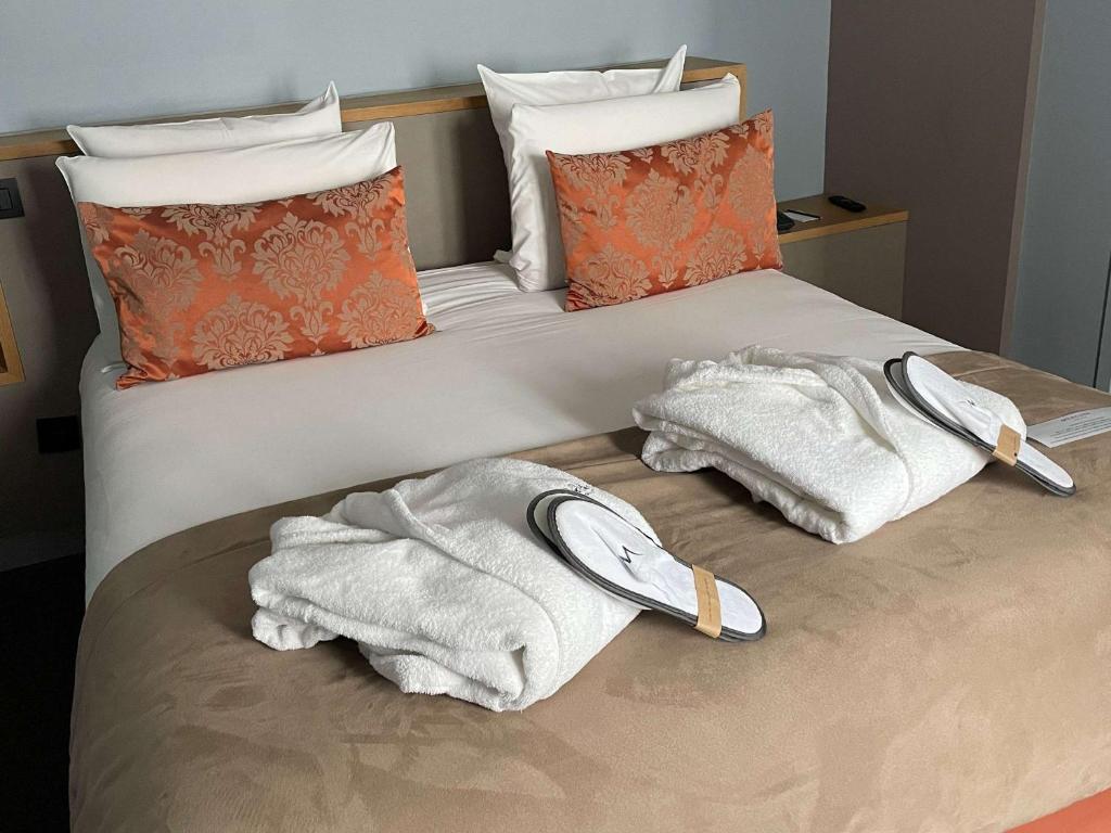 Postel nebo postele na pokoji v ubytování Mercure Lyon Charbonnières