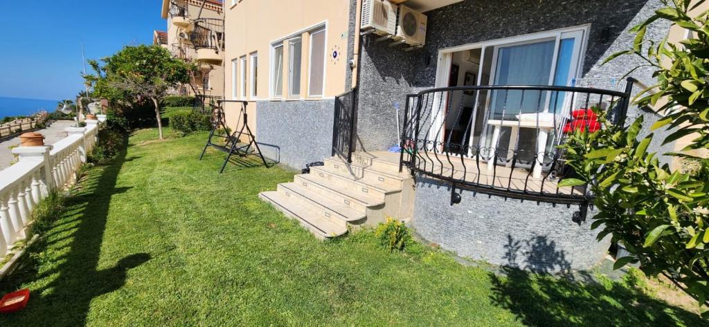 a group of stairs leading up to a house at Goldctiy otel villa in Alanya