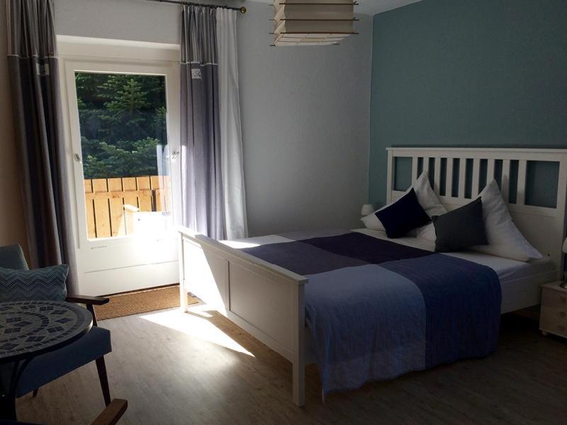 Postel nebo postele na pokoji v ubytování Ferienwohnung-Momo-Villa-Strawalde-Altenau-Oberharz