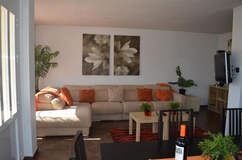 a living room with a couch and a table at Casa Lucero in Rojales