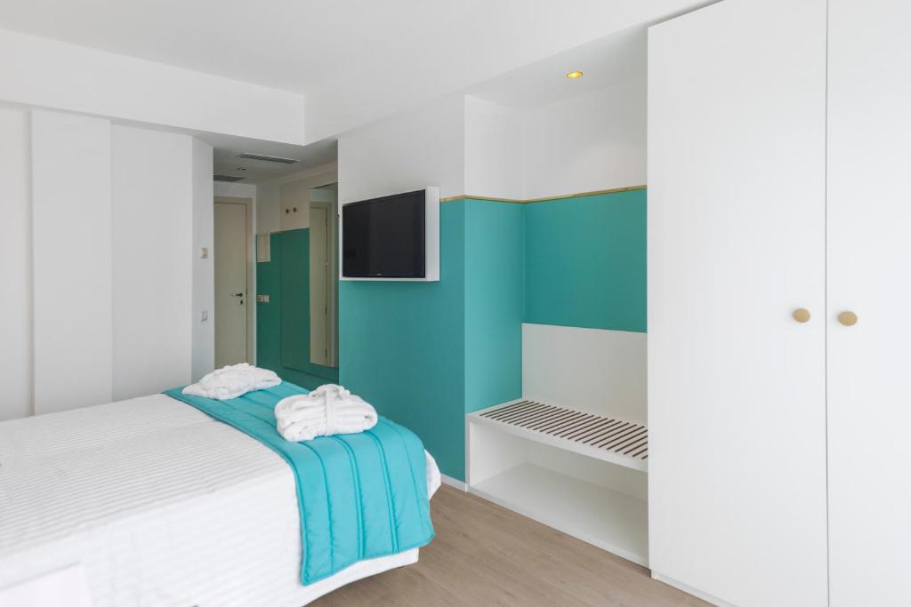 Postel nebo postele na pokoji v ubytování Hotel Tiffany's