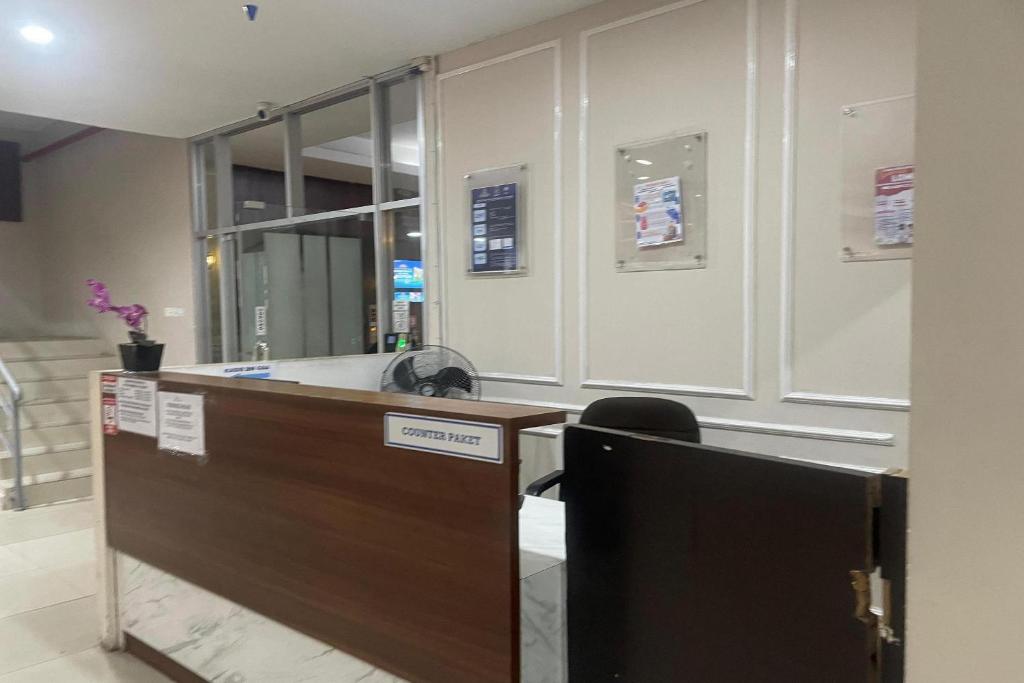 a lobby with a reception desk in a building at Hotel O Grand Asia Afrika Apartment By Qr Property in Bandung