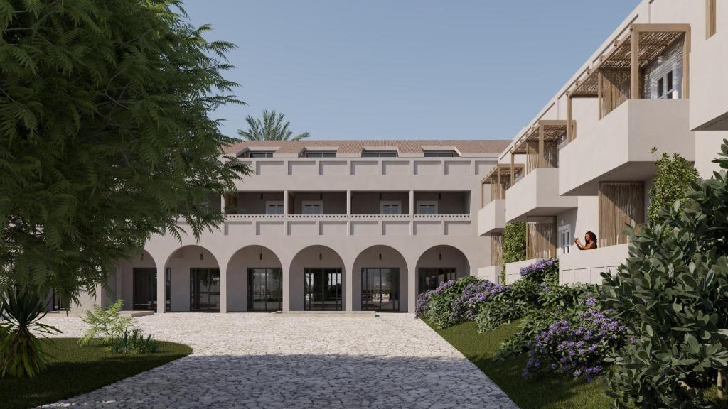 an external view of a building with a courtyard at NOBILIS CORFU Hotel in Acharavi