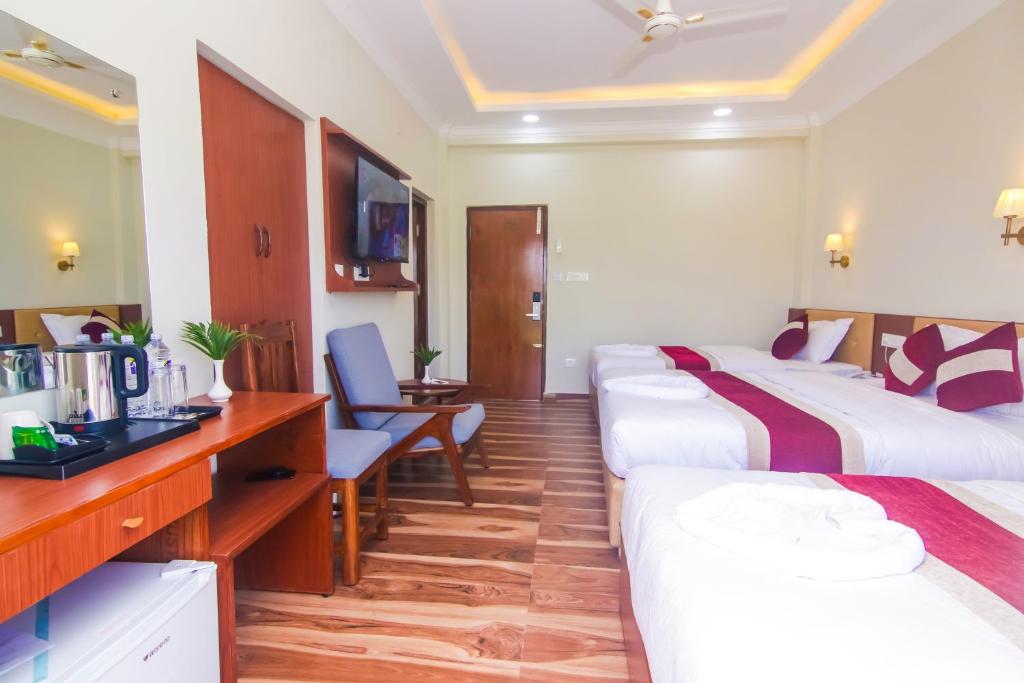 Postel nebo postele na pokoji v ubytování Hotel Yatra Sauraha Pvt Ltd
