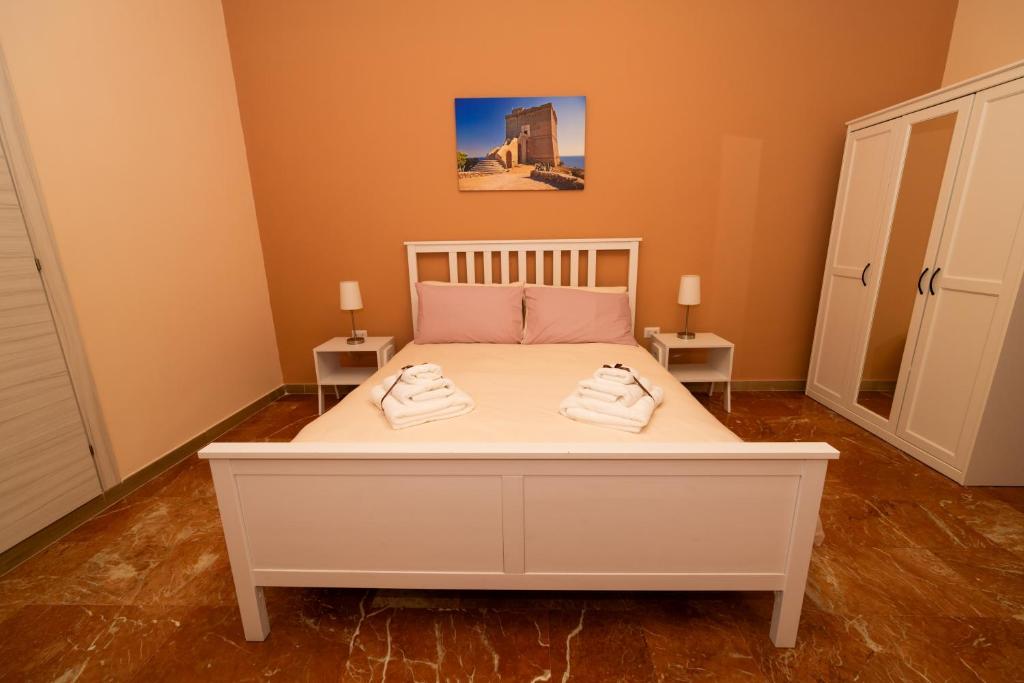 Postel nebo postele na pokoji v ubytování Apulia Concept B&B