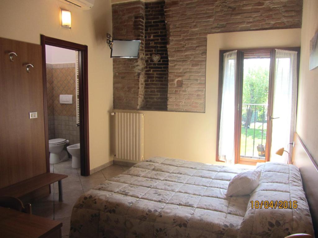 Posteľ alebo postele v izbe v ubytovaní Agriturismo Ravaglia Grande