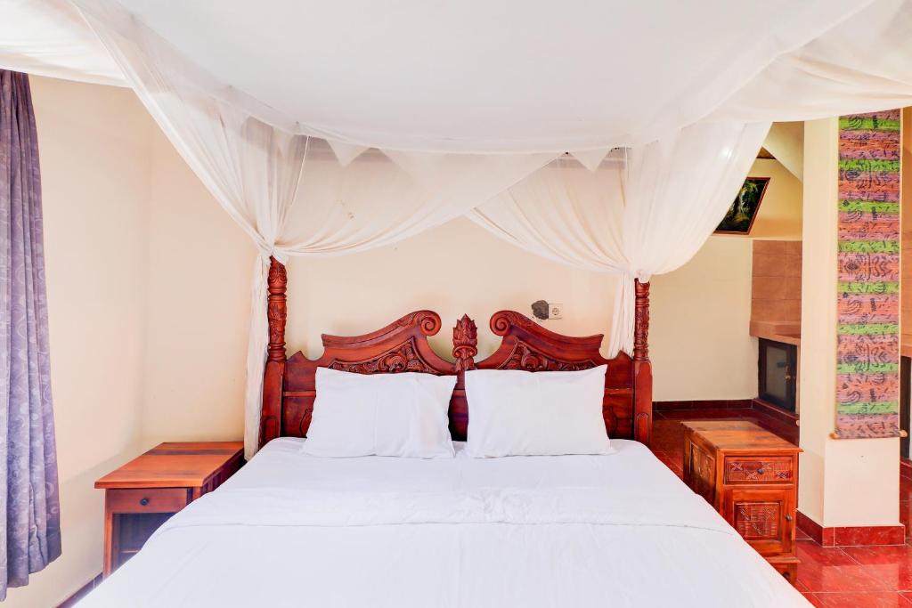 Postel nebo postele na pokoji v ubytování Hotel O Ubud Asri Homestay Near Monkey Forest