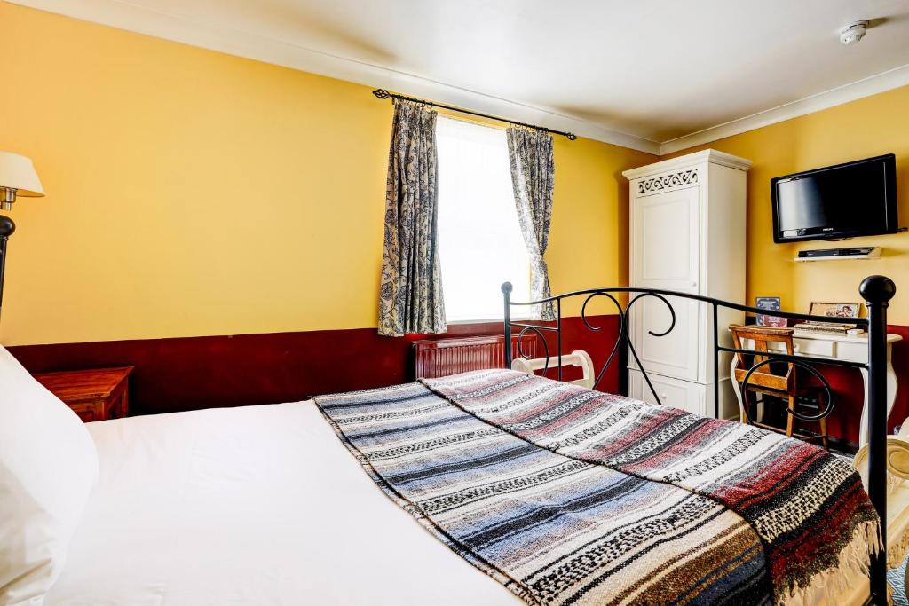 Postel nebo postele na pokoji v ubytování Church Street Hotel by Belvilla near The Oval London