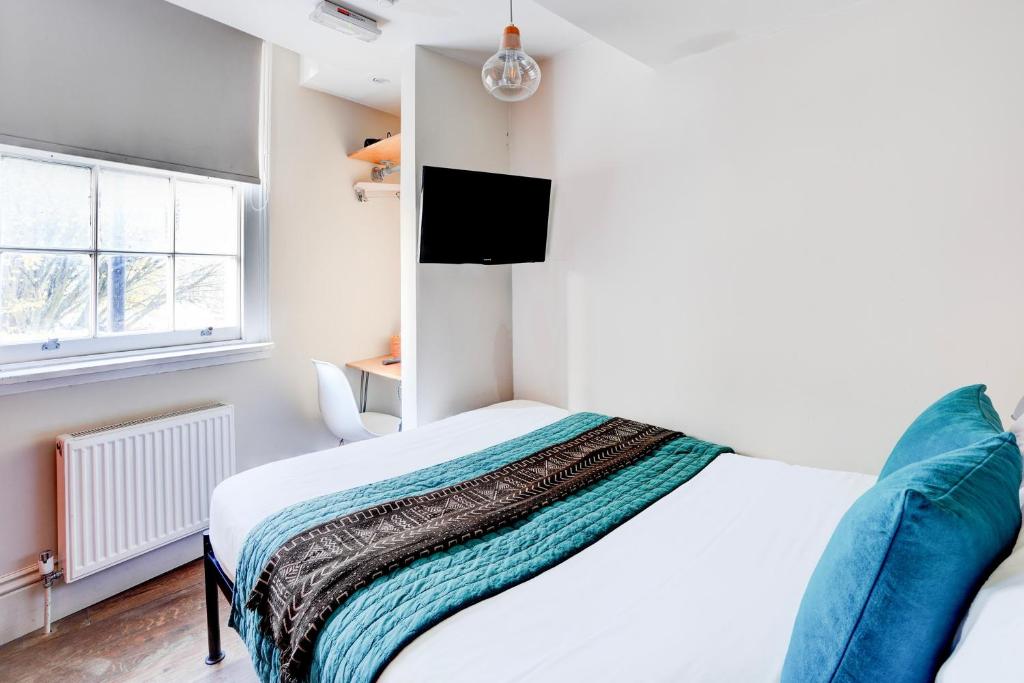 Postel nebo postele na pokoji v ubytování Peckham Rooms Hotel by Belvilla London