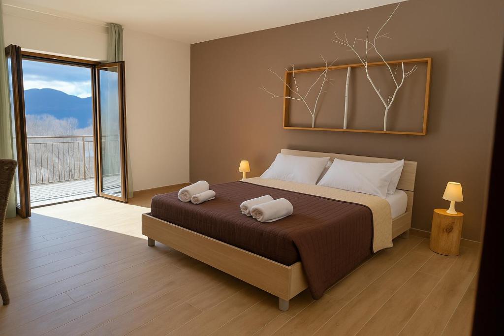 Postel nebo postele na pokoji v ubytování B&B Bosco Ralle - comfort e natura