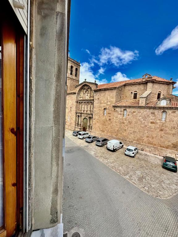 a view from a window of a building with parked cars at Apartamento de vistabella REF 015 in Vistabella del Maestrazgo