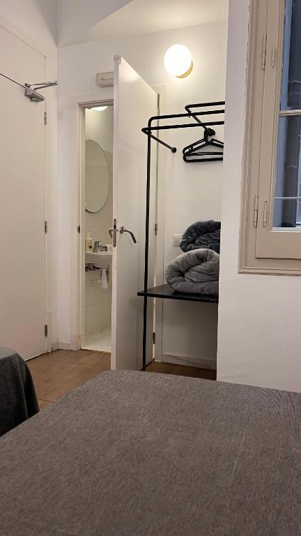 Posteľ alebo postele v izbe v ubytovaní Hostal Argo