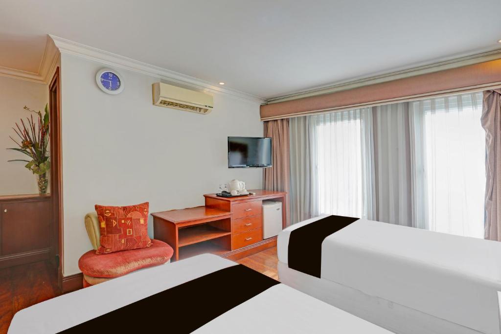 Postel nebo postele na pokoji v ubytování Townhouse OAK Makati Manila Near PNR Pasay Evangelista formerly VIP Suites