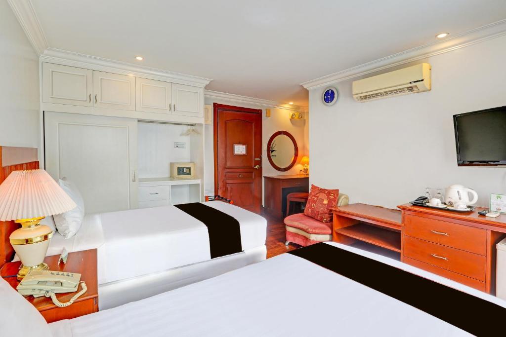 Postel nebo postele na pokoji v ubytování Townhouse OAK Makati Manila Near PNR Pasay Evangelista formerly VIP Suites