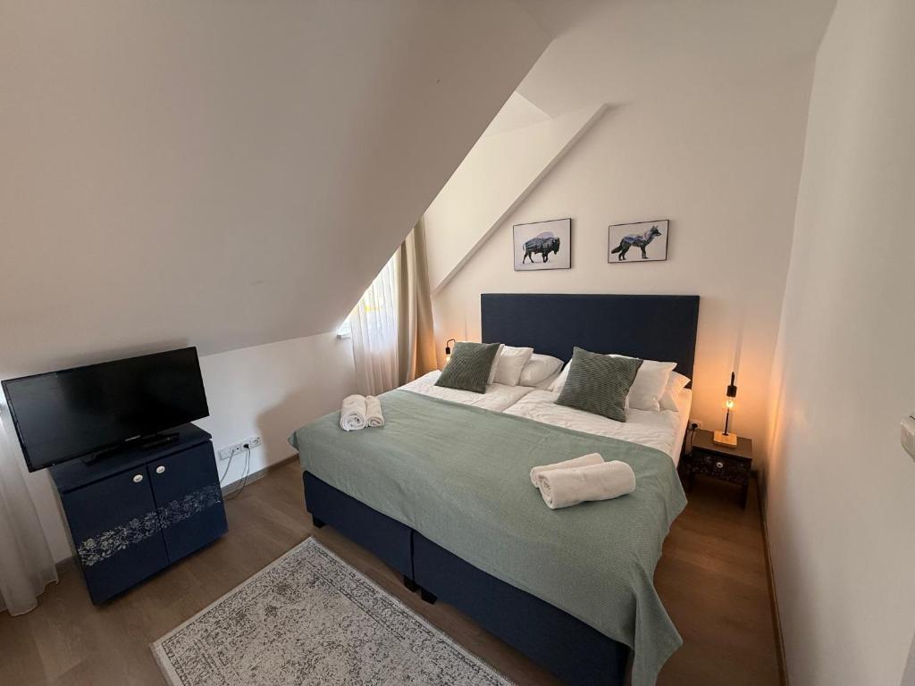 A bed or beds in a room at Penzión U Srnčíka