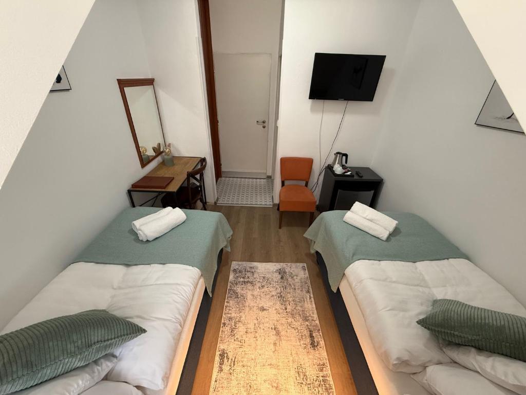 A bed or beds in a room at Penzión U Srnčíka
