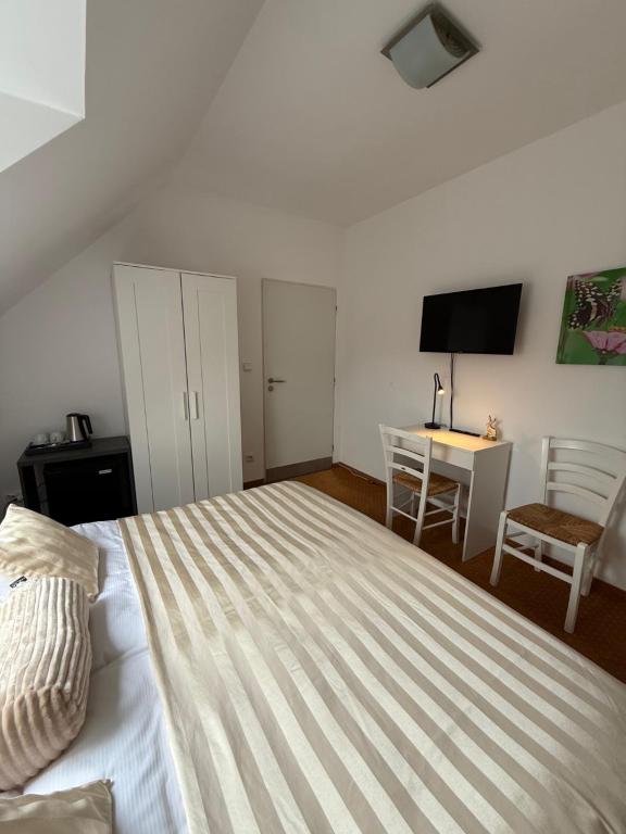 A bed or beds in a room at Penzión U Srnčíka