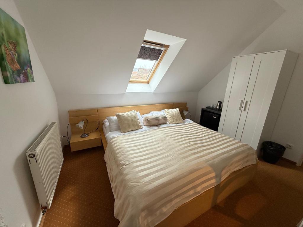 A bed or beds in a room at Penzión U Srnčíka