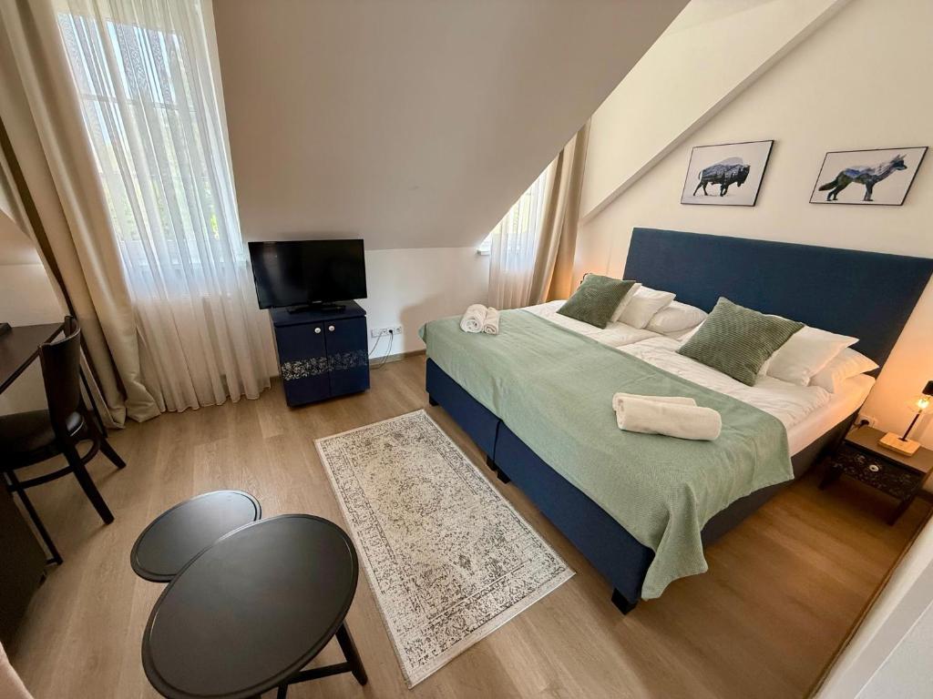 A bed or beds in a room at Penzión U Srnčíka