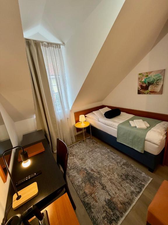 A bed or beds in a room at Penzión U Srnčíka
