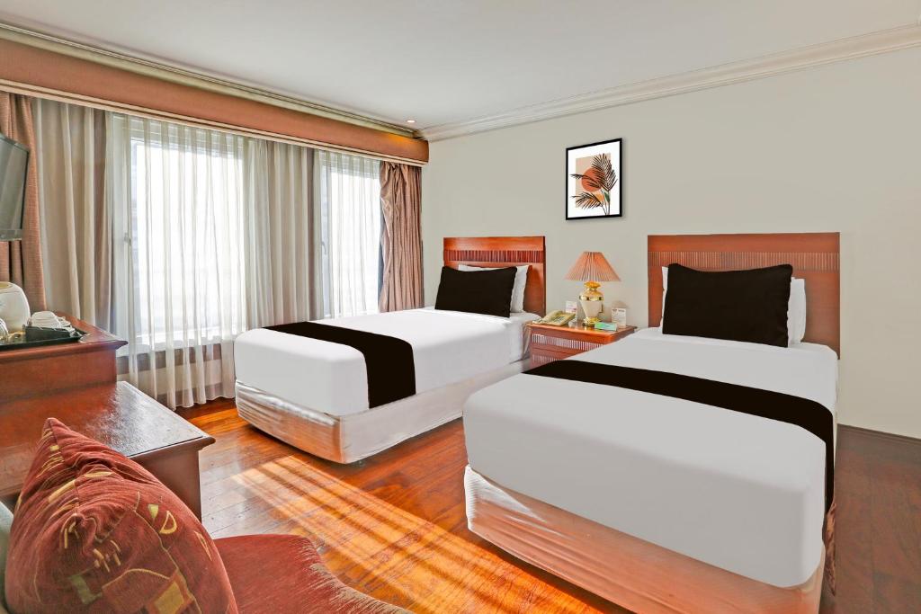Postel nebo postele na pokoji v ubytování Townhouse OAK Makati Manila Near PNR Pasay Evangelista formerly VIP Suites