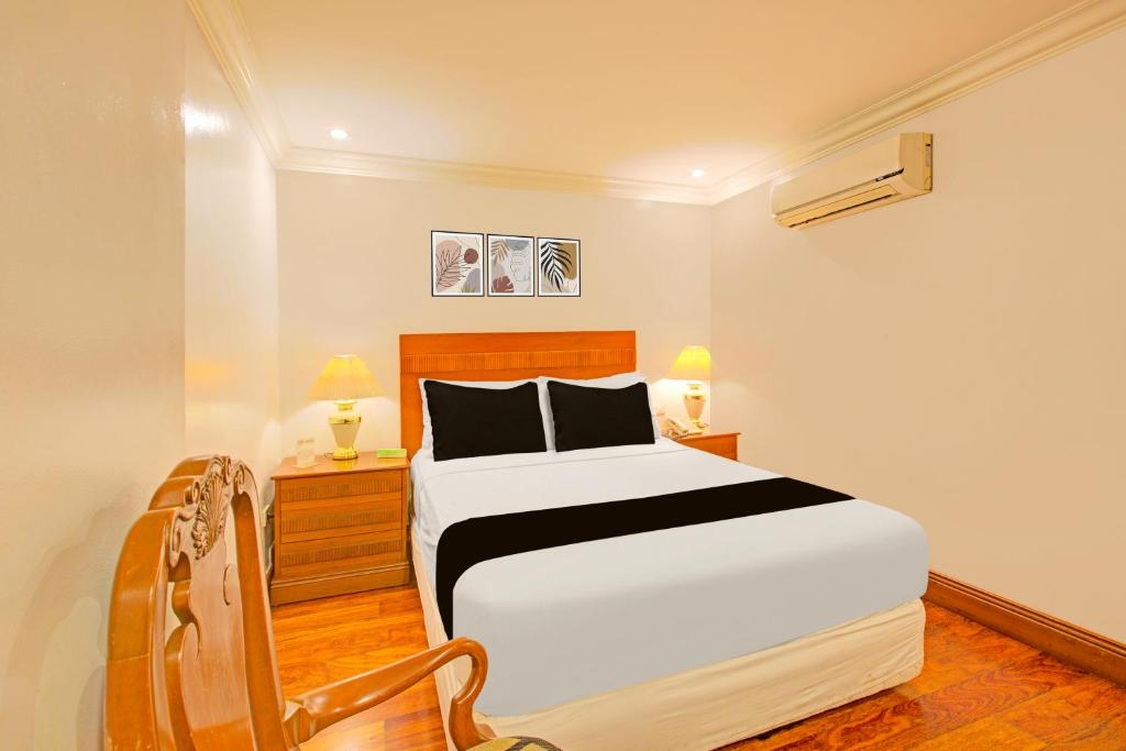 Postel nebo postele na pokoji v ubytování Townhouse OAK Makati Manila Near PNR Pasay Evangelista formerly VIP Suites