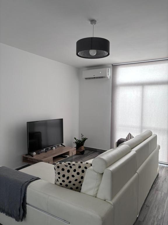 Televízia a/alebo spoločenská miestnosť v ubytovaní Nuevo Loft,cerca de la playa