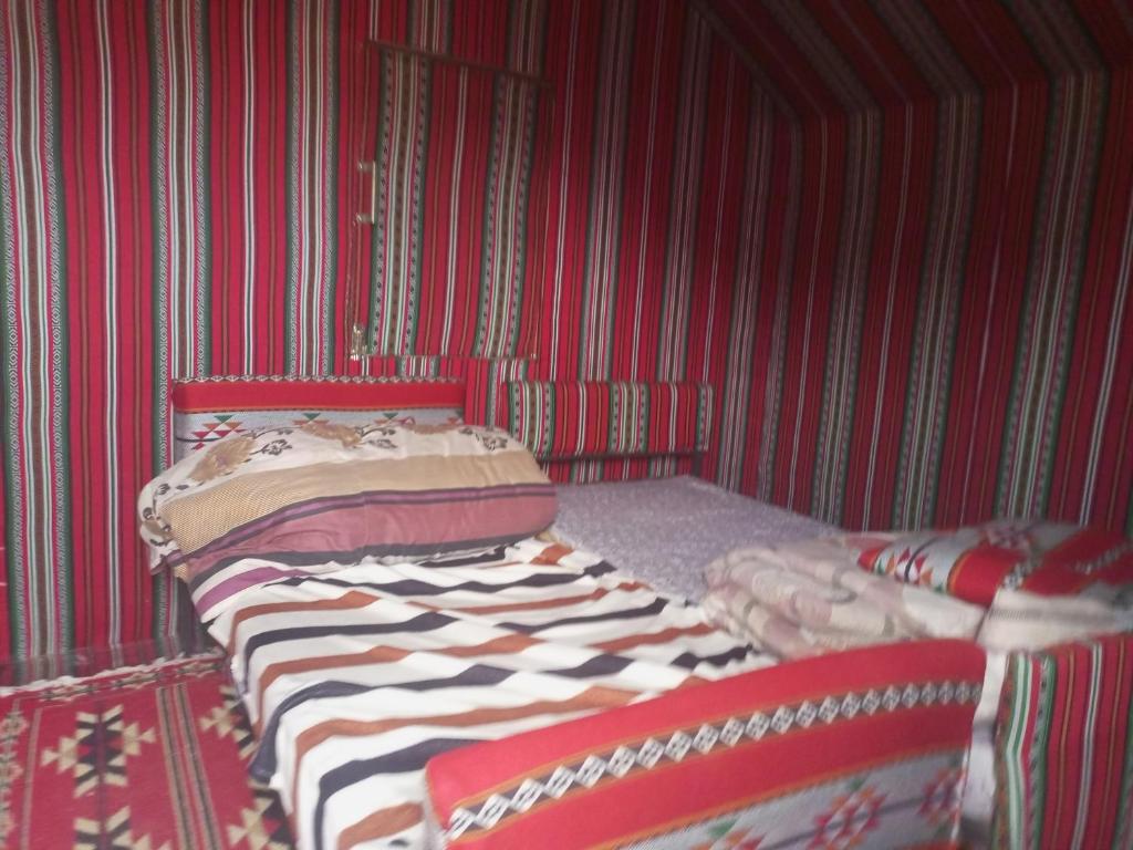 Postel nebo postele na pokoji v ubytování In Wadi Rum