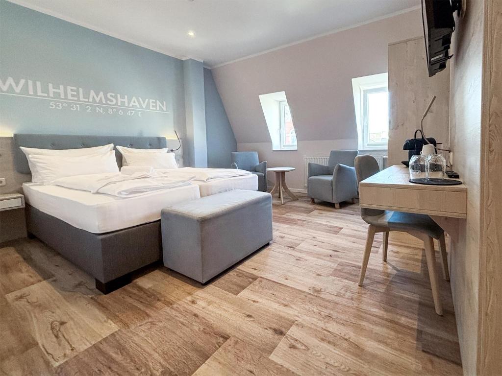 Postel nebo postele na pokoji v ubytování DORMERO Hotel Wilhelmshaven