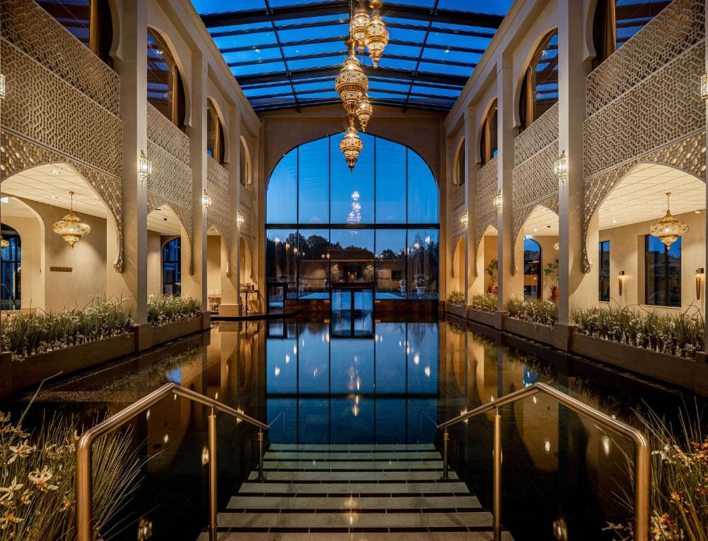 a view of a building with a pool of water at Hotel Thermen Berendonck in Nijmegen