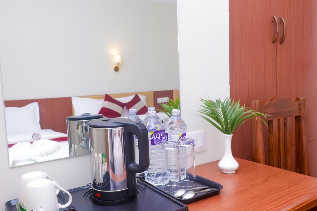 Postel nebo postele na pokoji v ubytování Hotel Yatra Sauraha Pvt Ltd