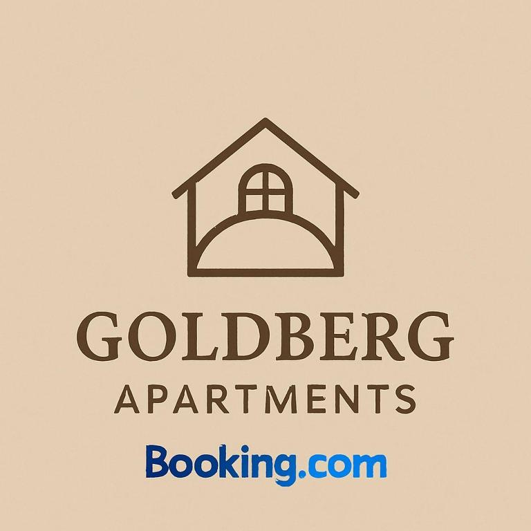 a sign for a house with the words goldberg apartments at Goldberg Apartments in Kassel