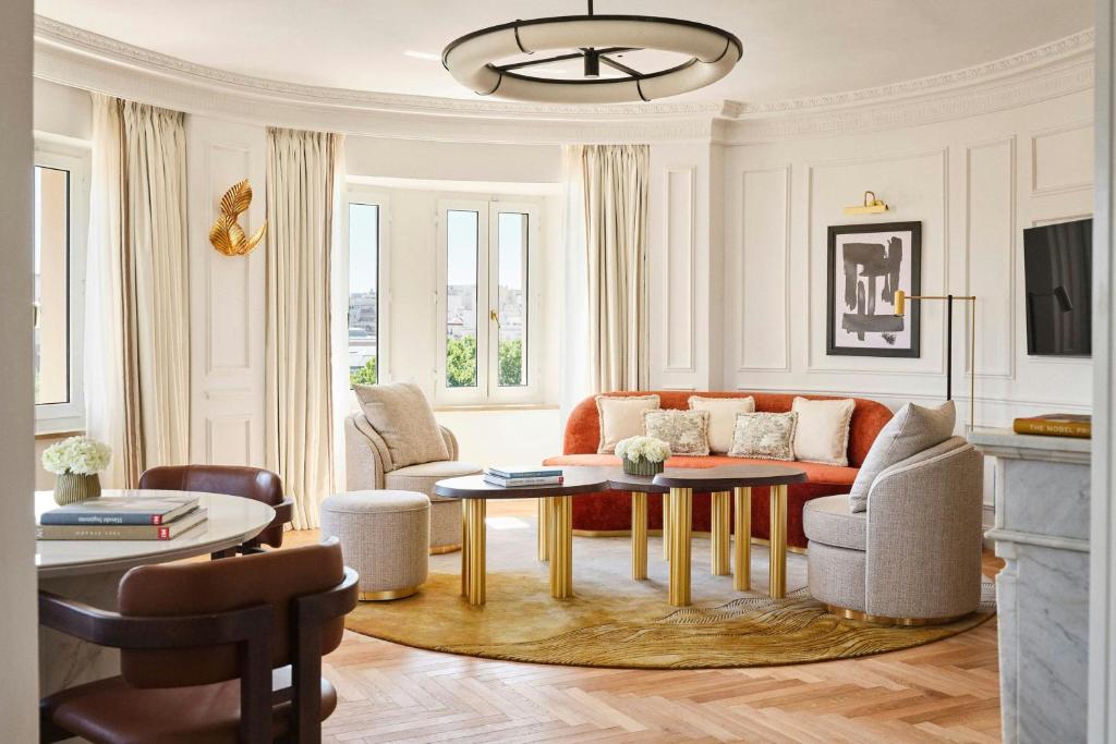 a living room with a couch and a table at The Palace, a Luxury Collection Hotel, Madrid in Madrid