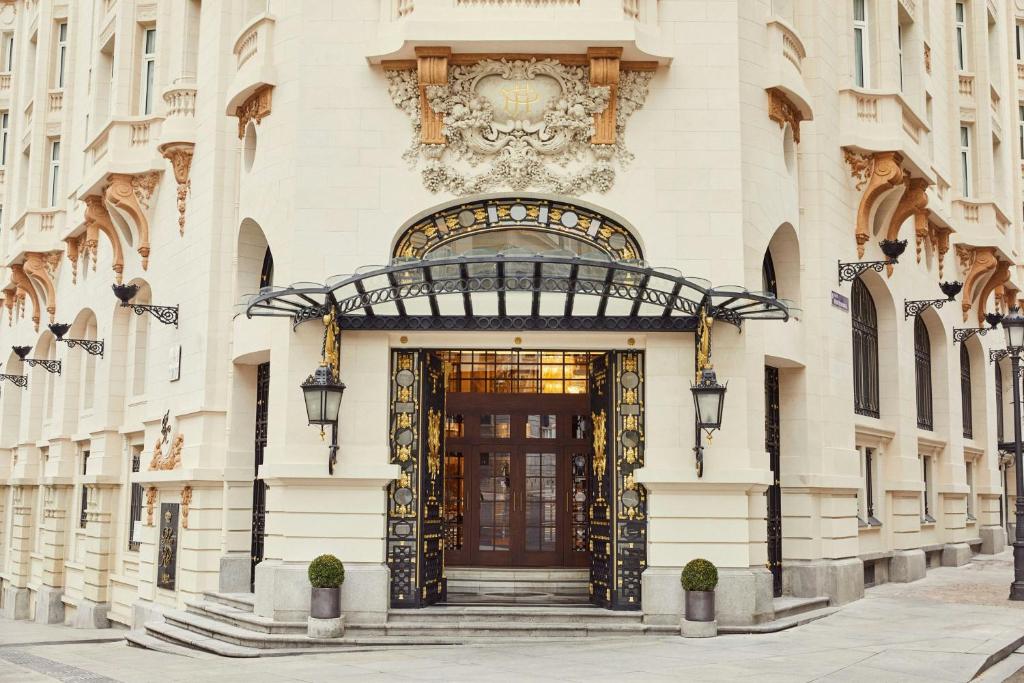 a facade of a building with a door at The Palace, a Luxury Collection Hotel, Madrid in Madrid