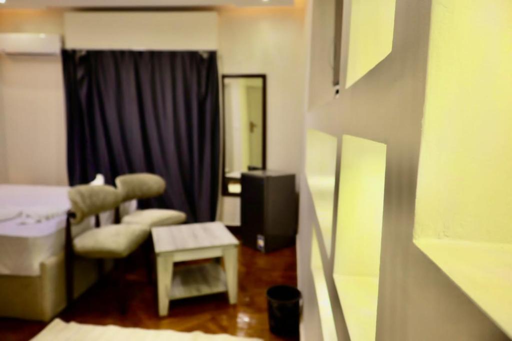Llit o llits en una habitació de Triple garden view hotel
