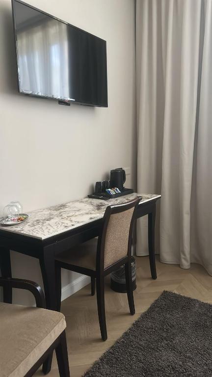 TV a/nebo společenská místnost v ubytování Hotel Comtur